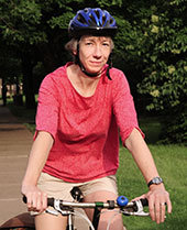 Faculty member on a bike