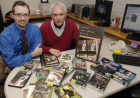 Iowa State psychology professors Douglas Gentile (left) and Craig Anderson (right) were co-authors of the book "Violent Video Game Effects on Children and Adolescents" and were significant contributors to a new international Media Violence Commission on the known effects of media violence exposure. Photo by Bob Elbert, ISU News Service