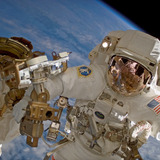 Clayton Anderson waves during a 2007 spacewalk at the International Space Station.