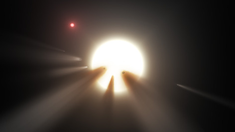 An illustration showing a star behind a shattered comet.