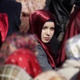 Muslim woman in a crowd