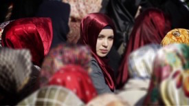 Muslim woman in a crowd