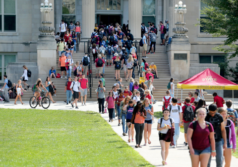 Students come and go on Curtiss Hall steps at Iowa State