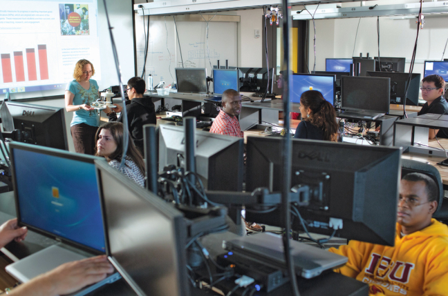 Iowa State graduate students work in Sukup Hall's Measurement and Control Systems Laboratory.