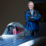 James Hill in the Team PrISUm garage with the team's latest solar racer.