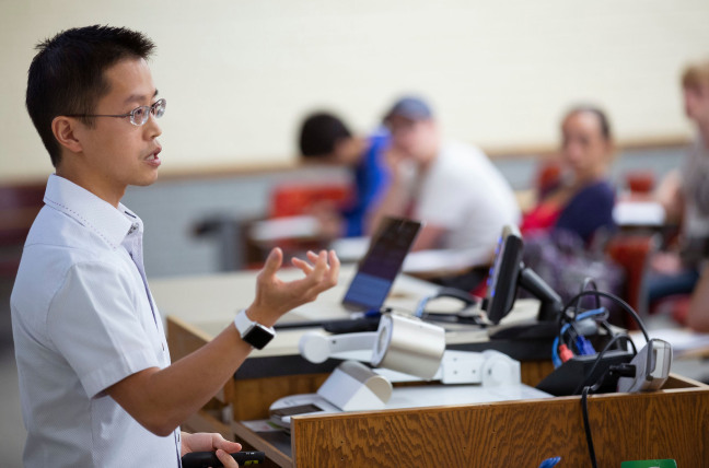 Jason Chan asks questions during a class lecture