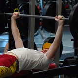 Man bench pressing weights
