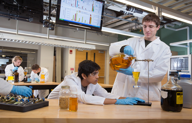 Students work in an agricultural and biosystems engineering lab.