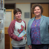 Portrait of Sara Davis and Abby Dubisar standing in clinic hallway