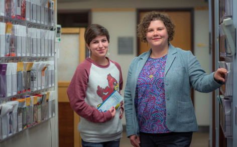 Portrait of Sara Davis and Abby Dubisar standing in clinic hallway