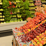 Fruits and vegetables in produce aisle of grocery store