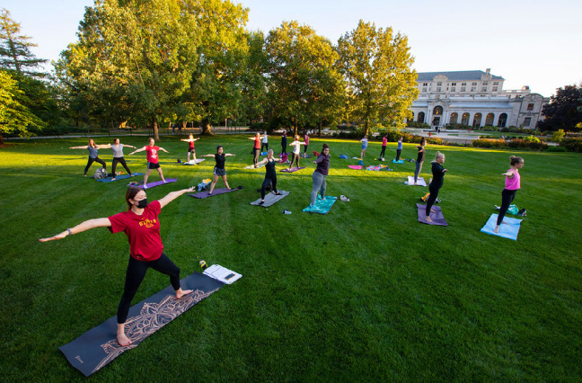Students doing yoga on central campus