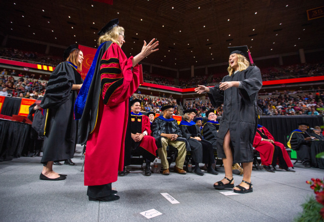 President Wintersteen congratulates student at commencement