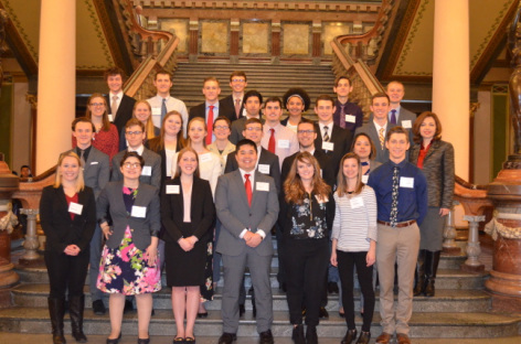 ISU students stand on a staircase inside the Iowa Capitol during a previous Research in the Capitol event