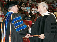 Geoffroy congratulations Graham Spanier, who received an honorary detree