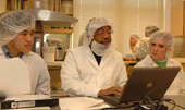 Deland Myers and students in lab