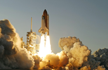 Clayton Anderson rides Space Shuttle Atlantis into space.
