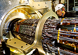 Technicians install the pixel detector within the ATLAS detector at the Large Hadron Collider near Geneva, Switzerland.