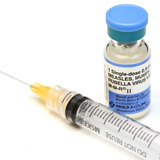 Bottle of MMR vaccine and needle