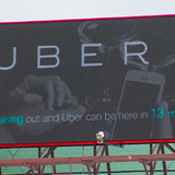 Digital billboard display of Uber ad created by Iowa State students