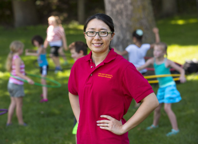 ISU graduate student Yang Bai with kids at fitness camp