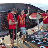 Students recharging the Team PrISUm solar racing car