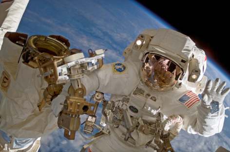 Clayton Anderson waves during a 2007 spacewalk at the International Space Station.