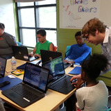 Students designing gliders on computers