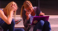 Students talking and texting on mobile phones