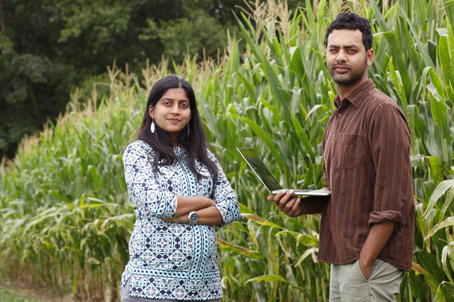 Shweta Chopra and Prashant Rajan standing near cornfield