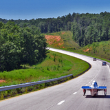 Team PrISUm's Phaeton 2 cruises down the road during the American Solar Challenge.