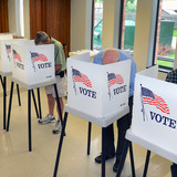 Voters at polling location casting ballots