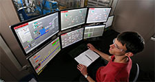 Andrew Friend works the control system of the solvent liquefaction pilot plant