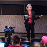 Tracy Lucht giving lecture on history of women journalists