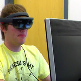 Student working on video game wearing Microsoft HoloLens