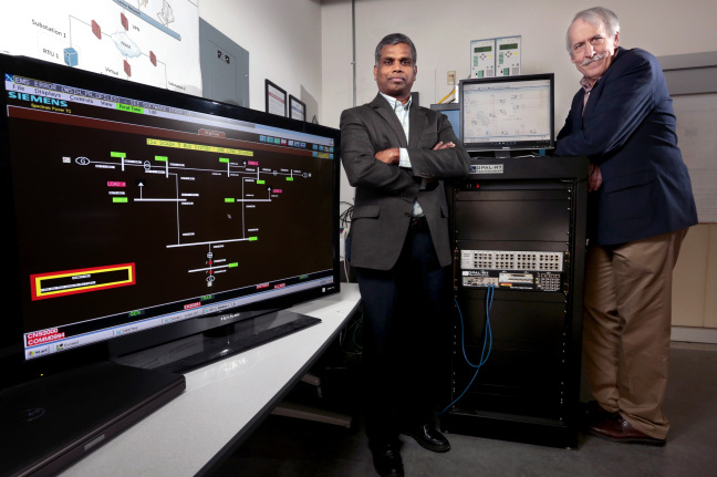 Manimaran Govindarasu, left, and Doug Jacobson have won grants to develop cyber security tools that can help protect the power grid.