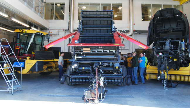 Students study ag machinery in an Iowa State class.