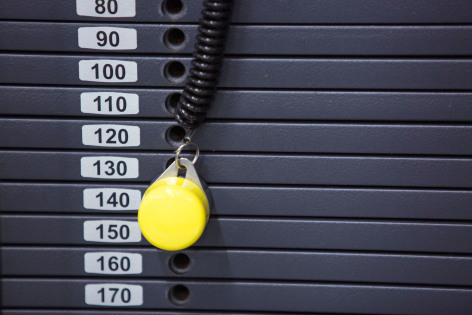 Close-up of pin setting weight on weight machine
