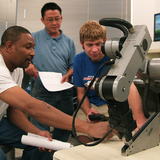 Students at Des Moines Area Community College work in a robotics lab.