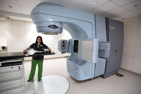 A technician operates the linear accelerator at the Iowa State small animal hospital