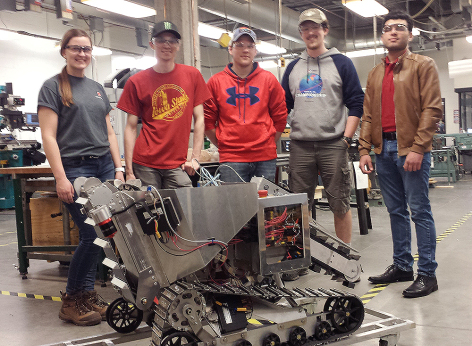 "Marineris," and four members of Cardinal Space Mining in an Iowa State lab.