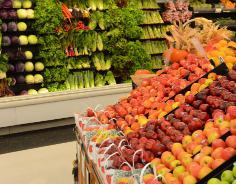 Fruits and vegetables in produce aisle of grocery store