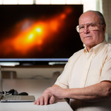 Allen Lawrence with the rare double-nucleus galaxy he helped reveal.