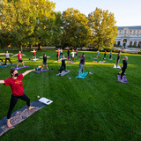 Students doing yoga on central campus