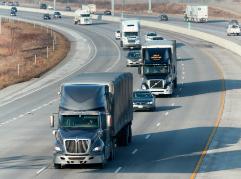 Semi trucks driving on interstate highway