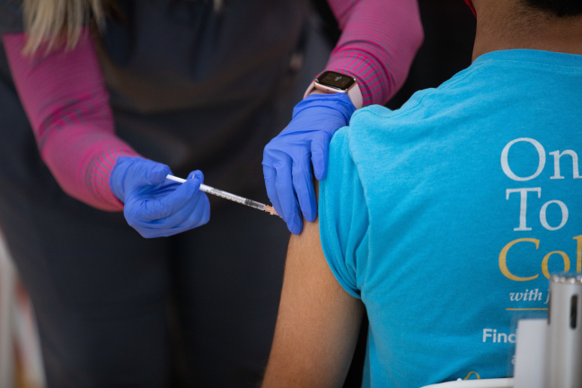 Administering COVID-19 vaccine