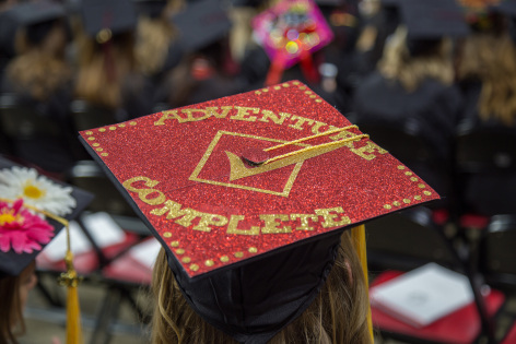 Decorated mortarboard at commencement