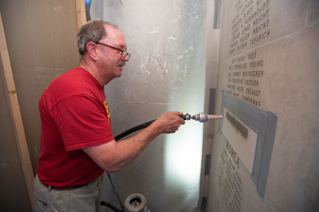 Etching new name into Gold Star Hall