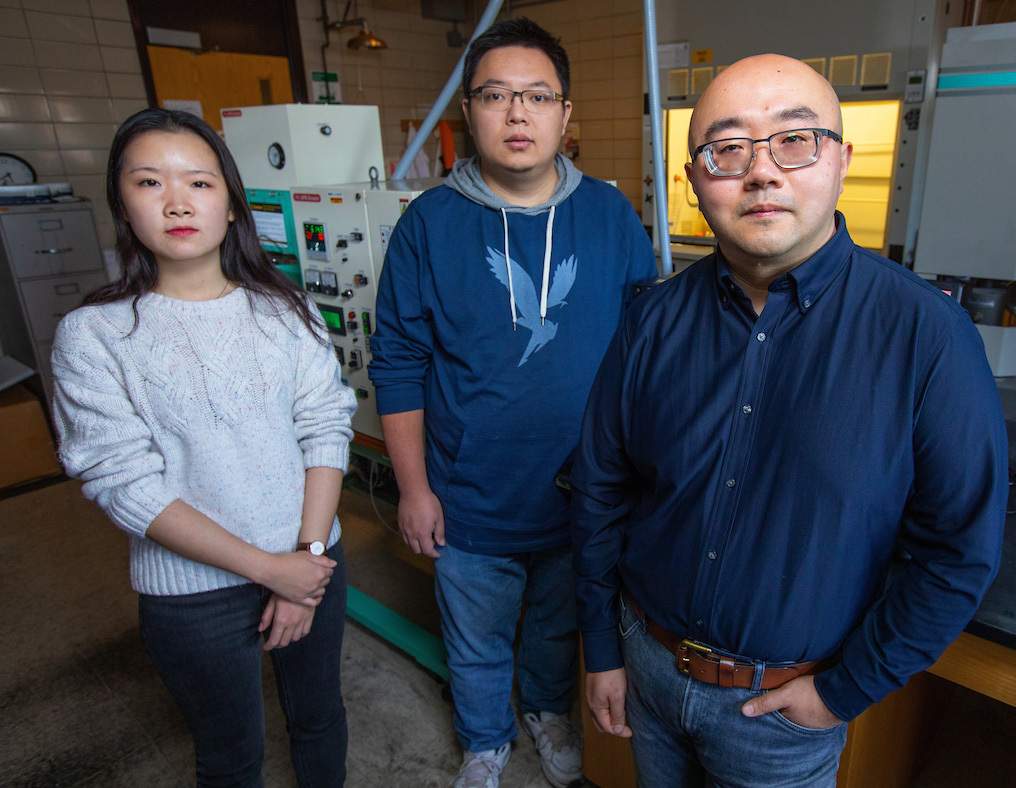 Engineers Yue Wu, Xiaopeng Liu and Fan Yang are shown in an Iowa State research lab.
