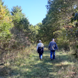 Two people walk on a trail at Stephens State Forest in south-central Iowa, Oct. 2021.